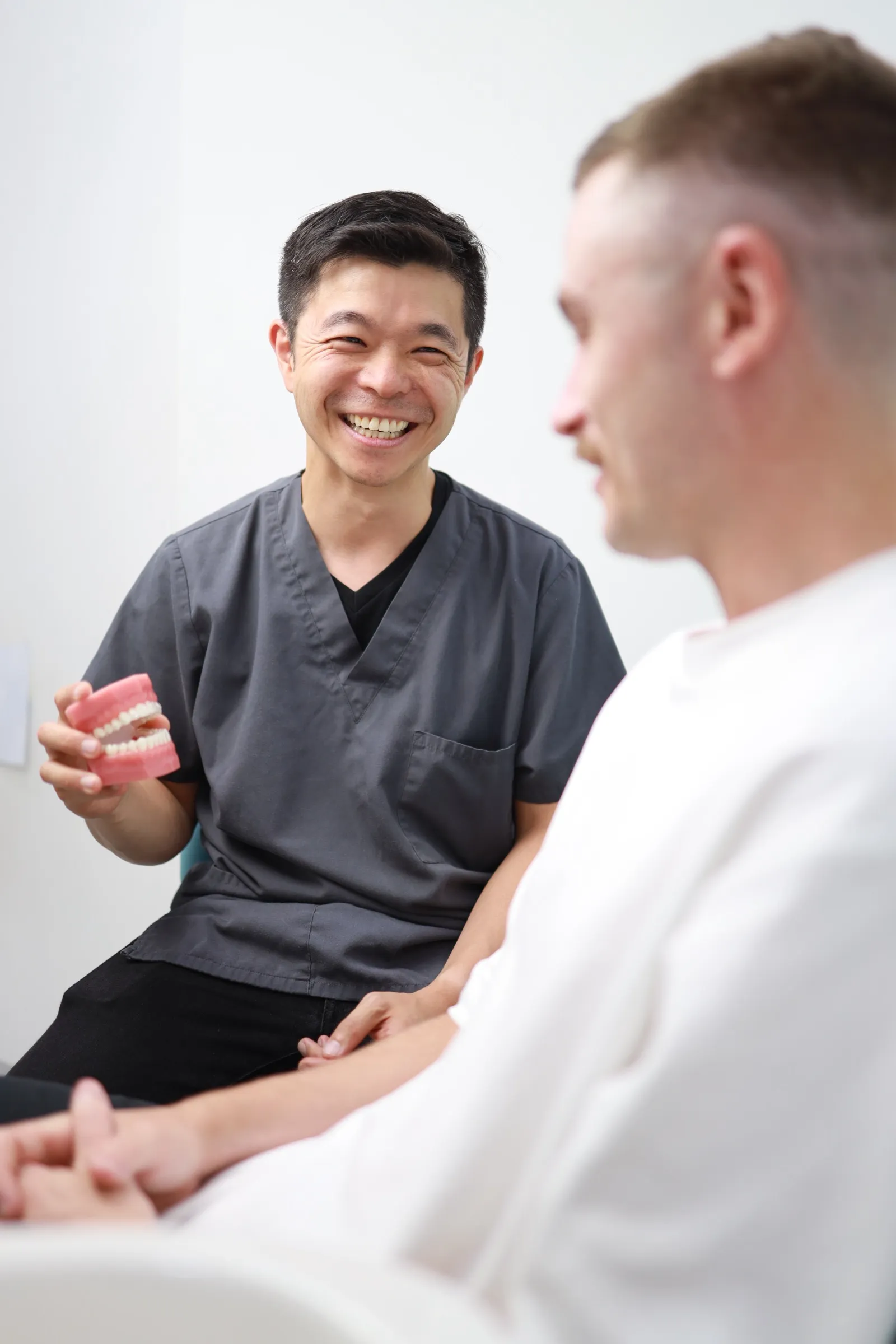 Auburn dentist explaining an urgent treatment plan to a patient